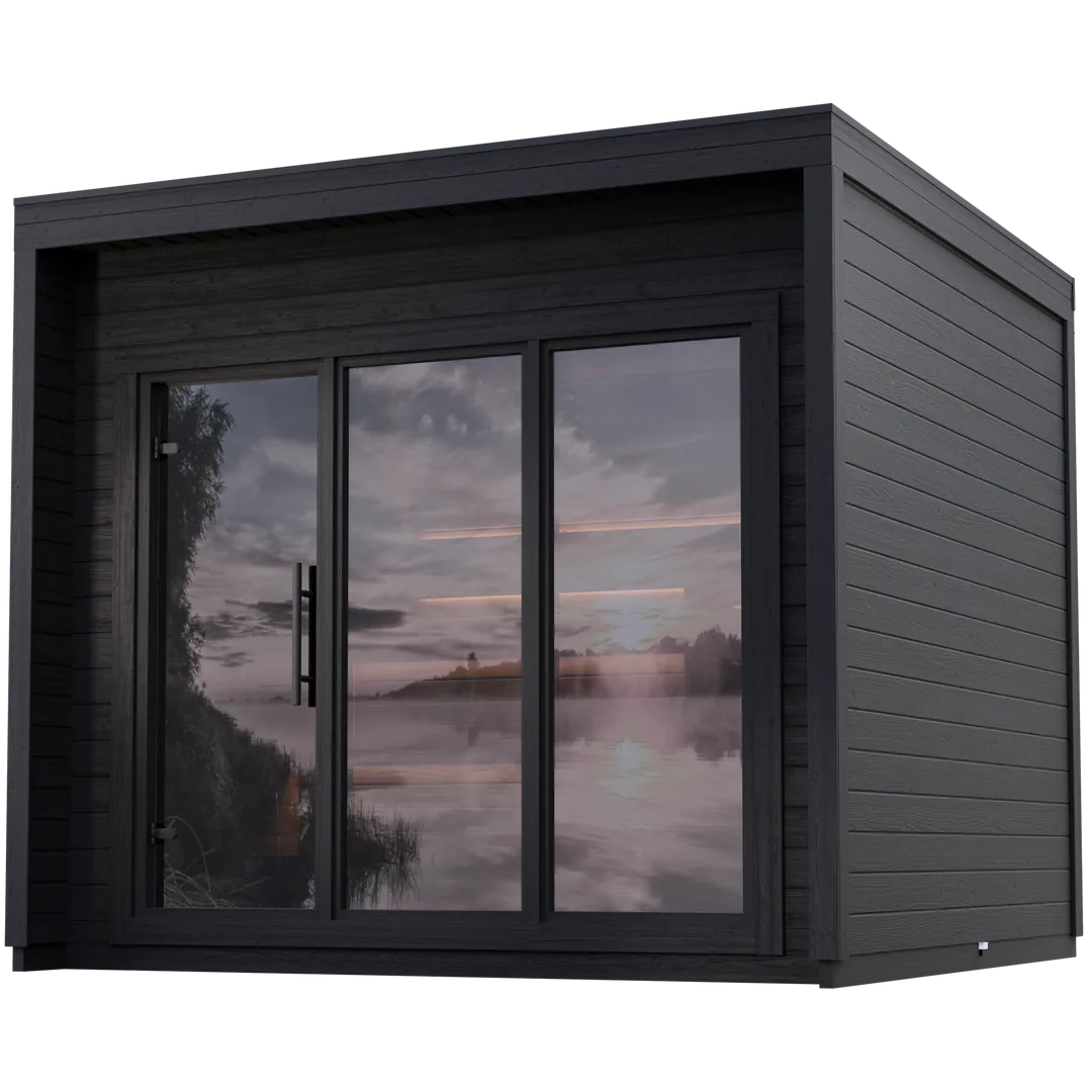 Loyly sauna cabin reflecting a Finnish lake sunset in its glass facade